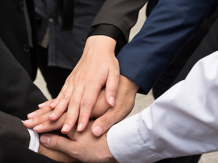 Hands in a circle indicating ethics