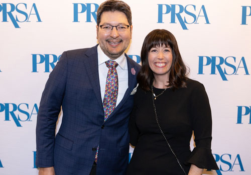Anvil Award Attendees at step and repeat with PRSA logo