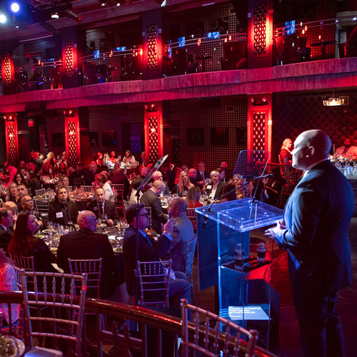 PRSA CEO at podium of Award Ceremony Dinner