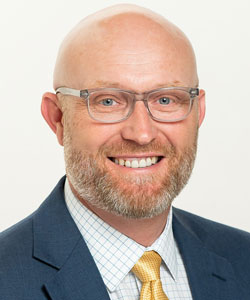 headshot of Sam Sims