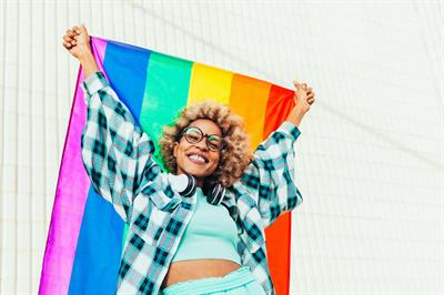woman holding pride flag