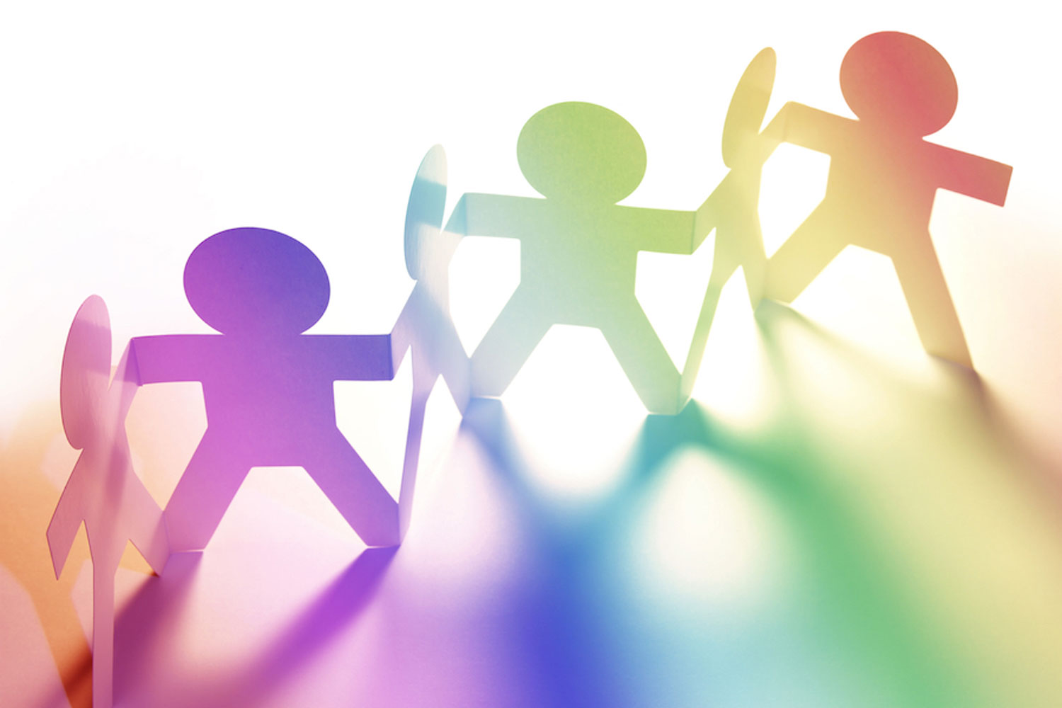 paper cutouts of people in rainbow colors