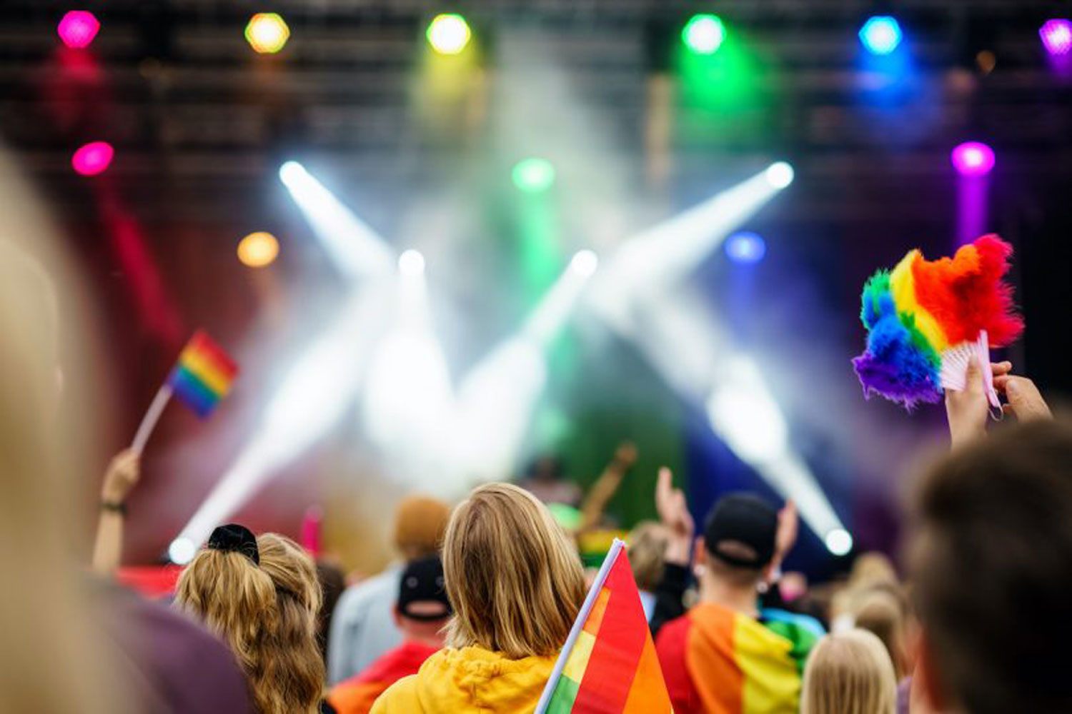 rainbow colored lights above crowd