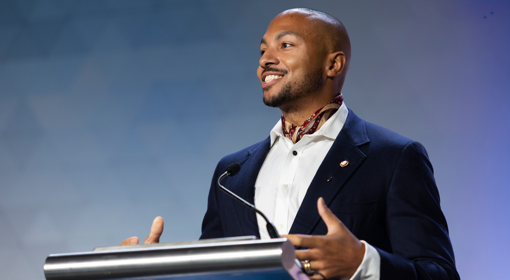 youngmalespeakeratpodiumICON2025