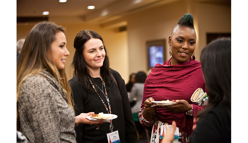 Member Group1 Three PRSA Members engaged in conversation at a member event.
