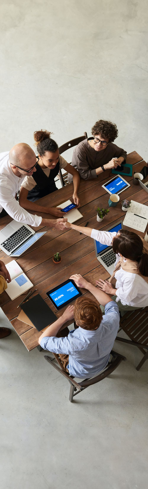 Overhead view of business people at conference table Overhead view of business people at conference table