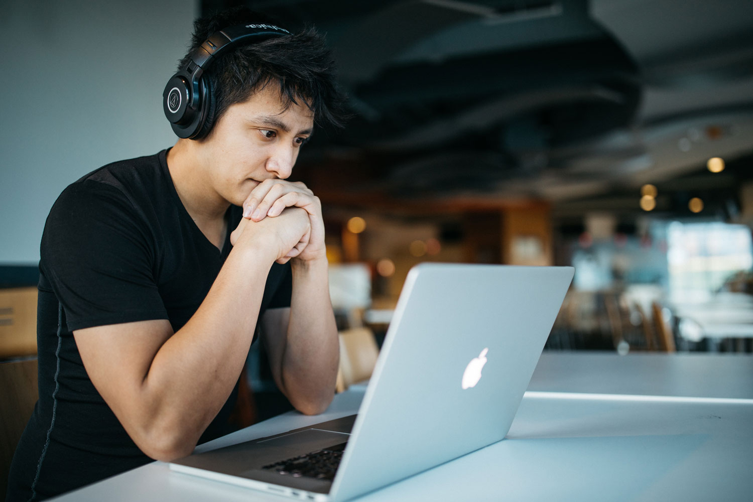 man watching webinar on laptop