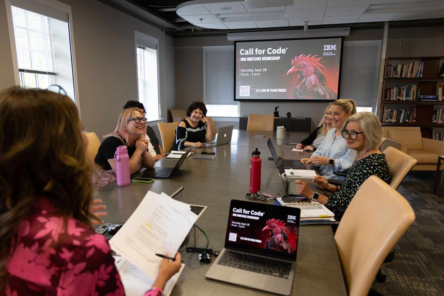 young adults at conference table
