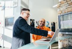 man-pointing-laptop-computer