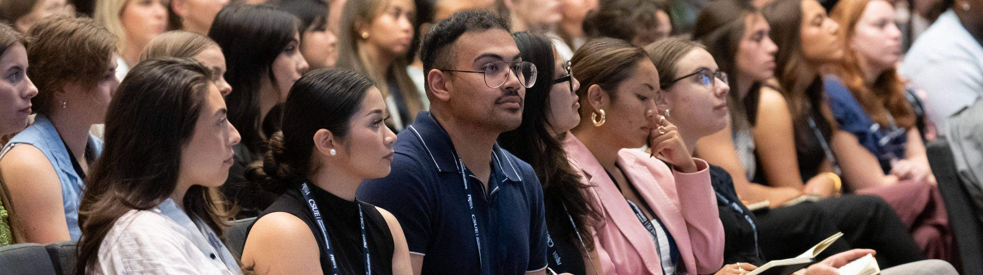 attentive students in lecture hall