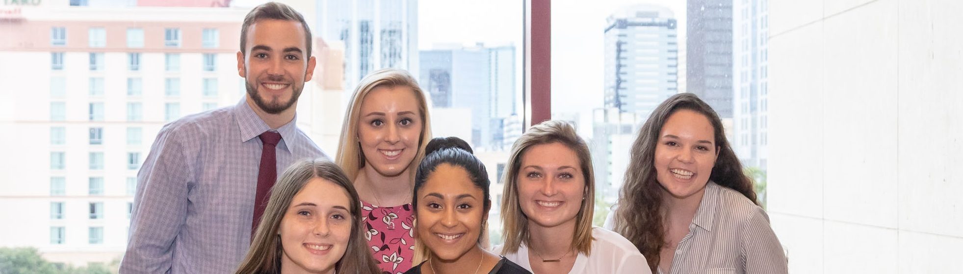 Six PRSSA students in front of window