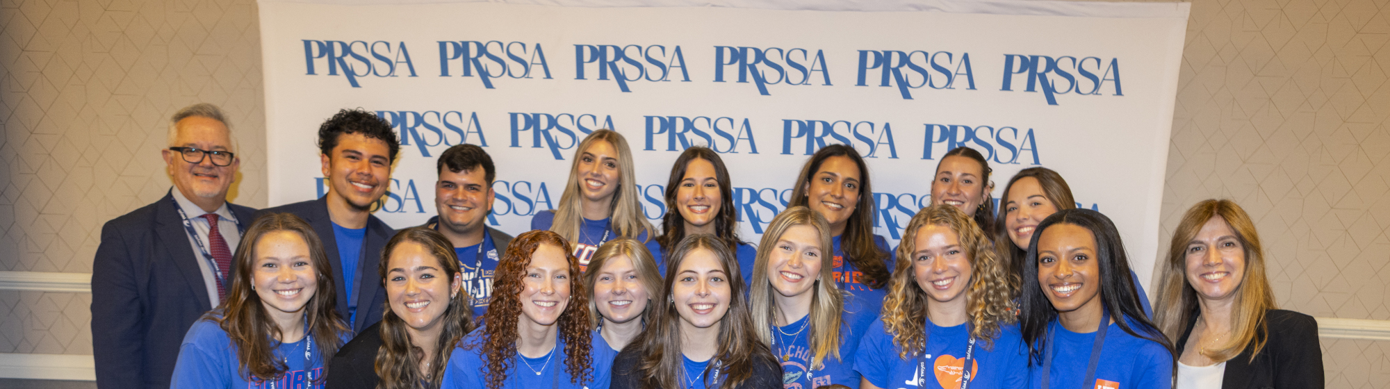 Six PRSSA students in front of window